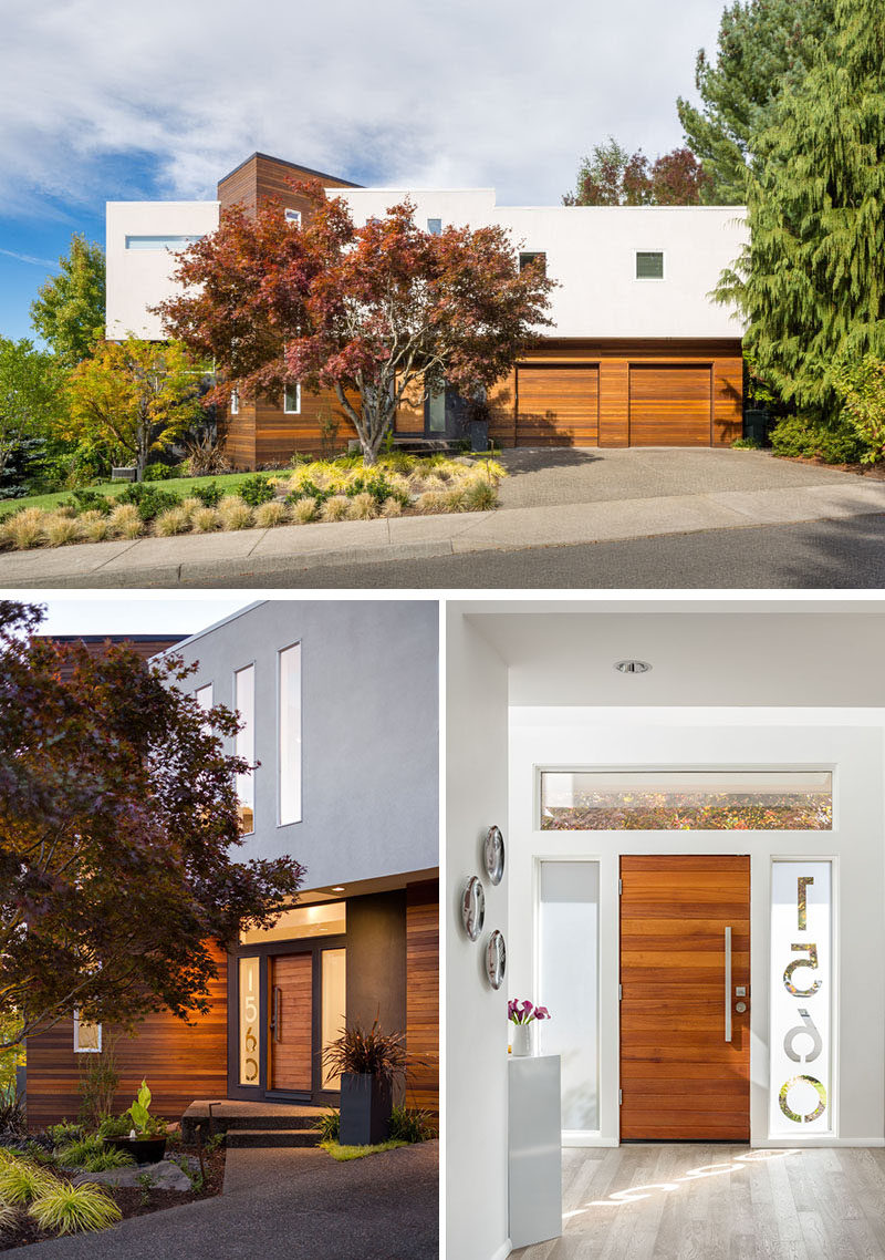 This modern house has a horizontal wood front door with the house numbers etched into the glass window beside the door. #FrontDoor #ModernDoor #HouseNumbers