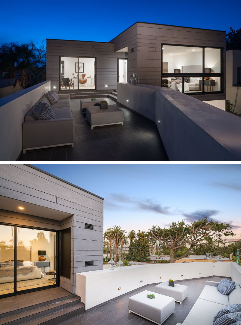 This rooftop patio, which is furnished with a couch and a few ottomans, can be accessed from the backyard as well as the master bedroom and office. #RooftopPatio #OutdoorSpace