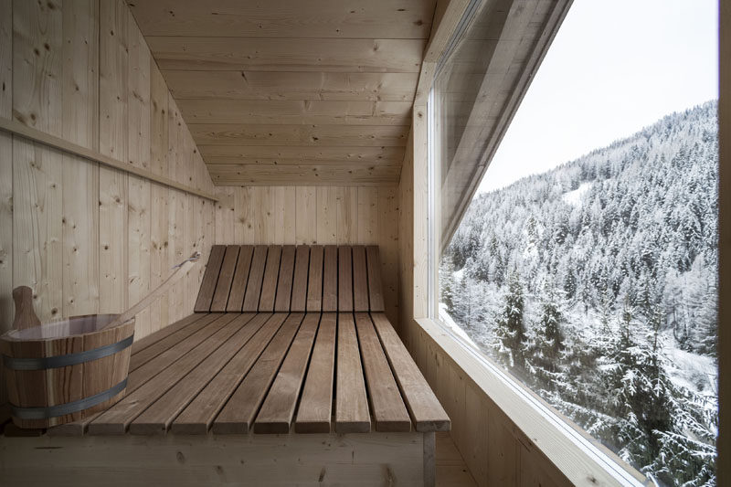 This penthouse suite at an Italian hotel has a sauna with a large picture window for viewing the mountains. #Sauna #Windows