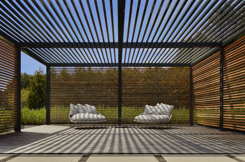 This garden also has a semi-enclosed square pergola structure with 2” x 4” ipe slat walls and hollow aluminum slats overhead. #ModernPergola #Landscaping #OutdoorSpace