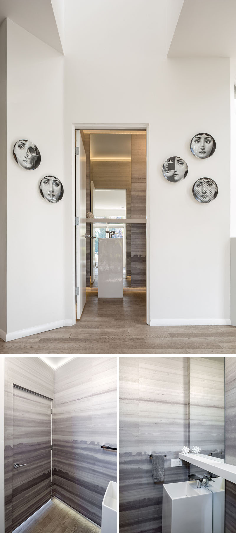 This modern bathroom features custom Phillip Jeffries watercolor wallpaper with accent LED strip lighting on the ceiling and floor, and a free standing vessel sink with a floor-to-ceiling custom mirror. #ModernBathroom #ModernWallpaper