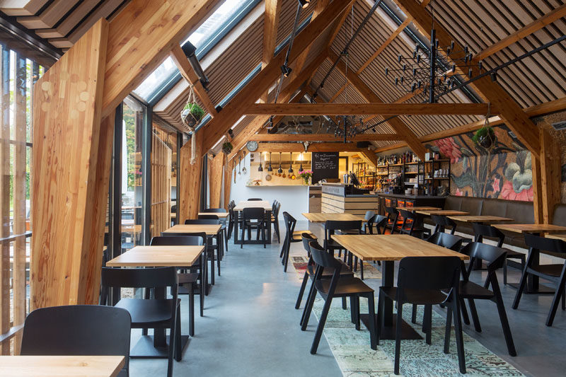 This restaurant is located in a barn-like building that shows off the structure of the building. #Restaurant #Architecture