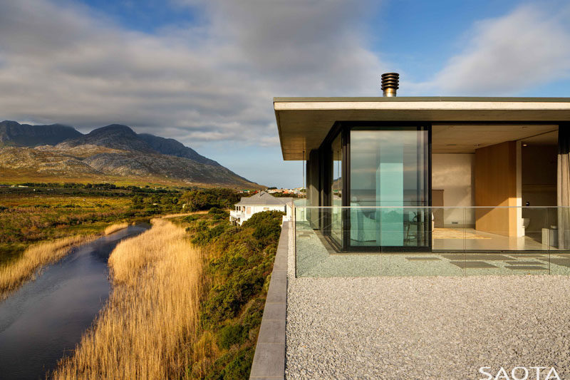 SAOTA have designed a new family holiday home that's perched on the banks of the Buffels River, close to Pringle Bay in South Africa. #ModernHouse #ModernArchitecture