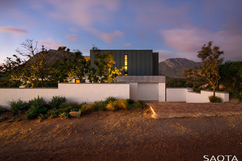 SAOTA have designed a new family holiday home that's perched on the banks of the Buffels River, close to Pringle Bay in South Africa. #ModernHouse #ModernArchitecture