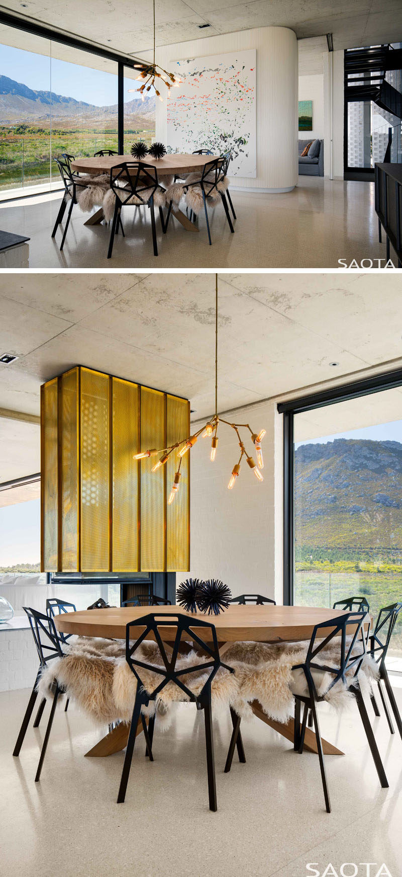 This modern house has a fireplace with punched brass cladding. Next to the fireplace is the dining room that features a custom-made table by James Mudge, accentuated by the Lindsey Adelman pendant light. Black Magis chairs surround the table and are softened with sheepskins throws. #Fireplace #ModernDiningRoom