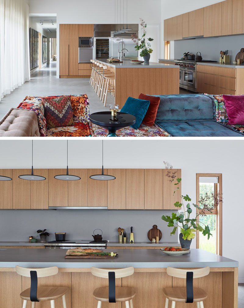 In this modern kitchen, light wood cabinets are combined with grey countertops and stainless steel appliances. #ModernKitchen #WoodAndGrey