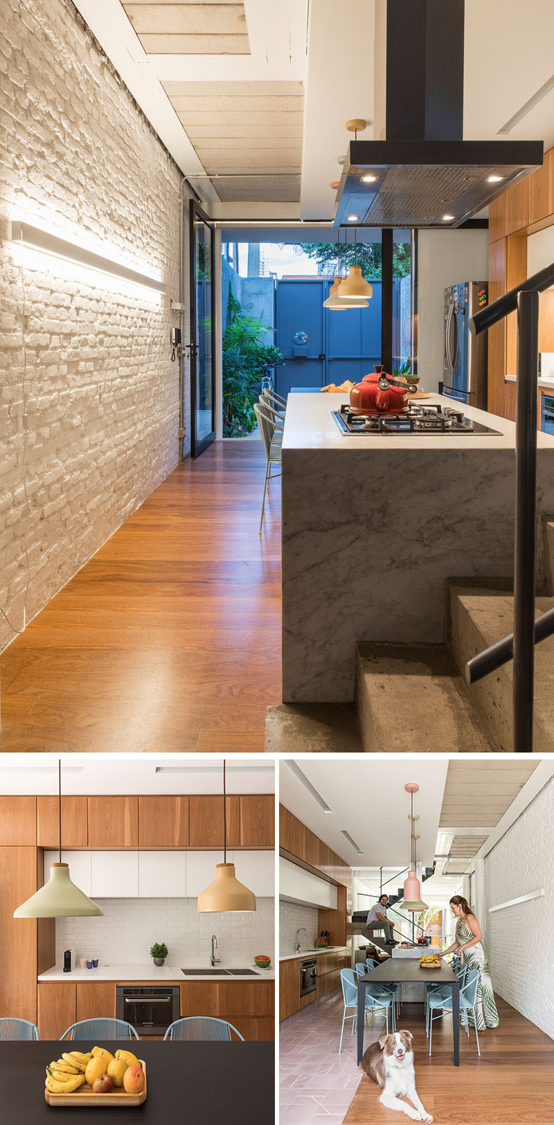 In this modern kitchen, an brick wall has been painted white to keep the space bright and welcoming. On the opposite wall, there's minimalist wood and white cabinets, while the kitchen island and a dining table runs the length of the kitchen. #KitchenDesign #PaintedBrick