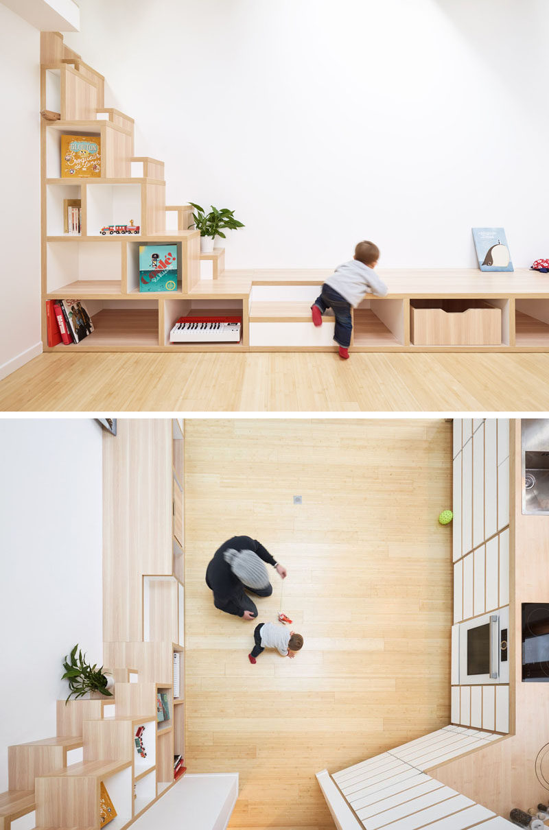 A set of narrow stairs with open shelving lead up to a lofted area in this small home. #ModernStairs #StairDesign #NarrowStairs