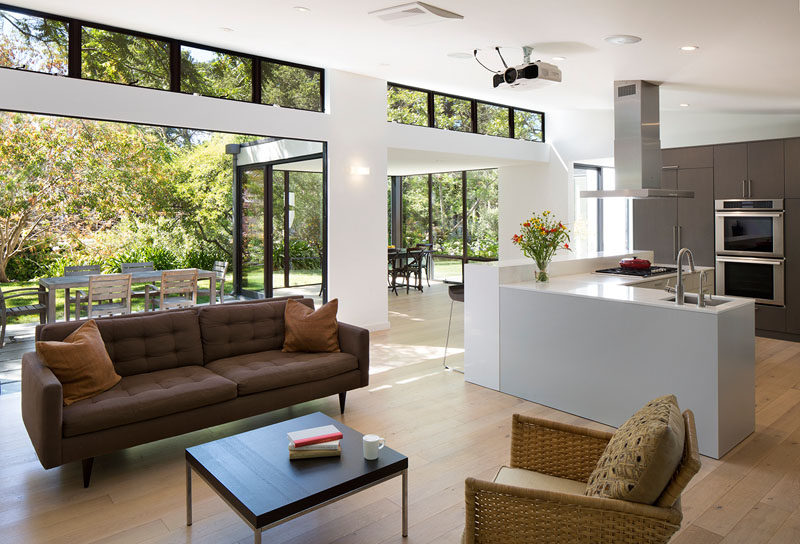 Sliding glass doors have been used to create an indoor / outdoor living environment for this modern house. #ModernInterior #SlidingGlassWalls