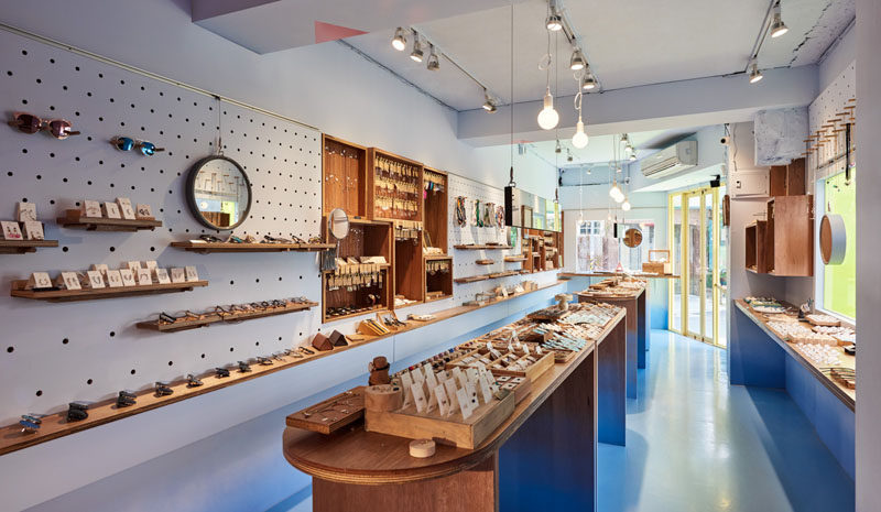 This modern retail store has pegboard walls that allow the owners of the store to display all product and if needed the shelves and hooks can easily be moved to change the layout of the walls. #RetailStore #Shelving #Pegboard