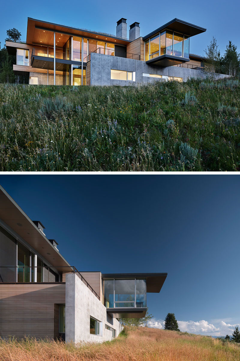 This modern house has a cantilevered office with floor-to-ceiling glass windows and uninterrupted views of the mountains. Click through to see more photos. #ModernArchitecture #ModernHouse #Cantilever #HomeOffice #Windows