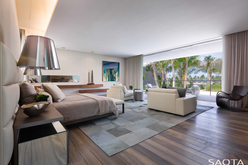 This large master bedroom suite enjoys the view from its own lounge area and balcony. #MasterBedroom