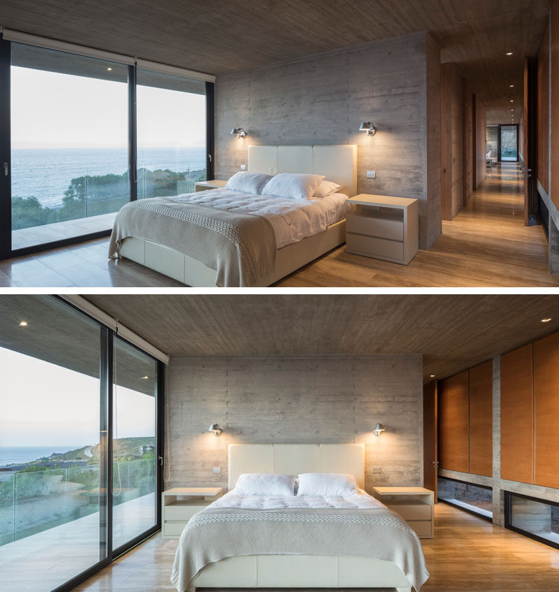 A structural concrete wall becomes an accent wall behind the bed, and floor-to-ceiling windows and a glass door allow plenty of natural light to fill the bedroom. Click through to see more photos of this modern house. #ConcreteHouse #Bedroom #ConcreteAccentWall #SlidingGlassDoors