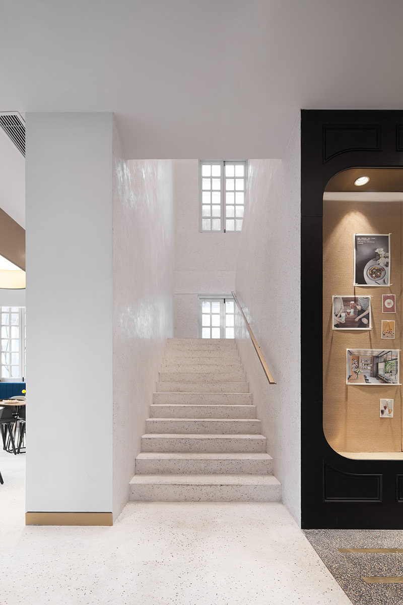 Simple light colored stairs connect the two different floors of this restaurant and cafe. #Stairs