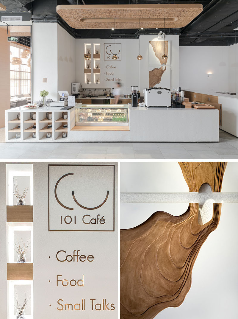 This modern coffee shop has a service area with open shelving, a cold case and a counter with the coffee maker. Back-lit display shelving brightens up a corner space, while artwork is highlighted with lighting. #ModernCoffeeShop #ModernCafe