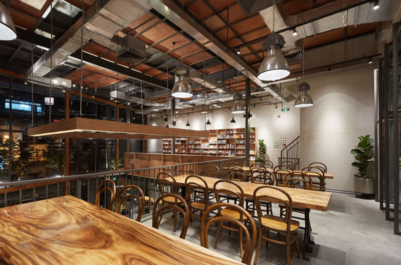 This modern coffee shop has a lofted area with communal tables, that can be used as a co-working space. #CoWorking #CoffeeShop #Cafe #CoffeeHouse