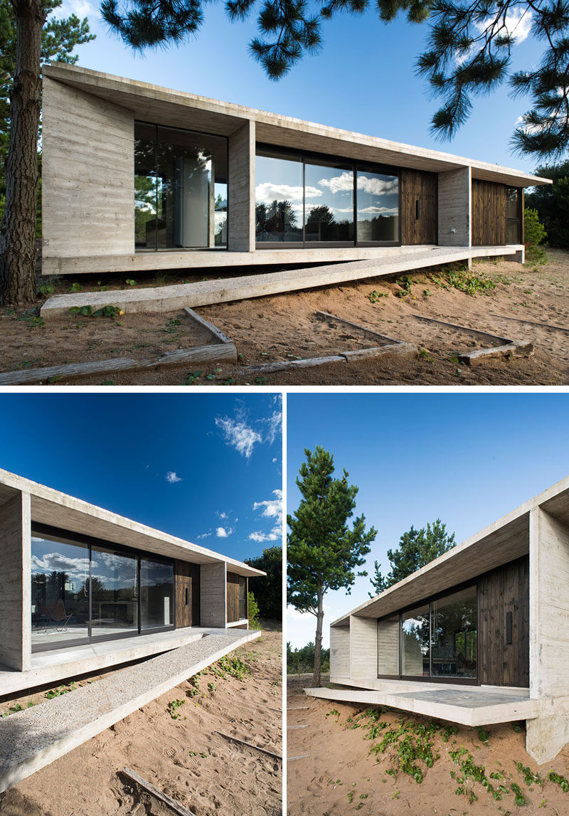 At the front of this modern concrete and wood house, a sloped pathway leads to the door. #ModernConcreteHouse #Architecture