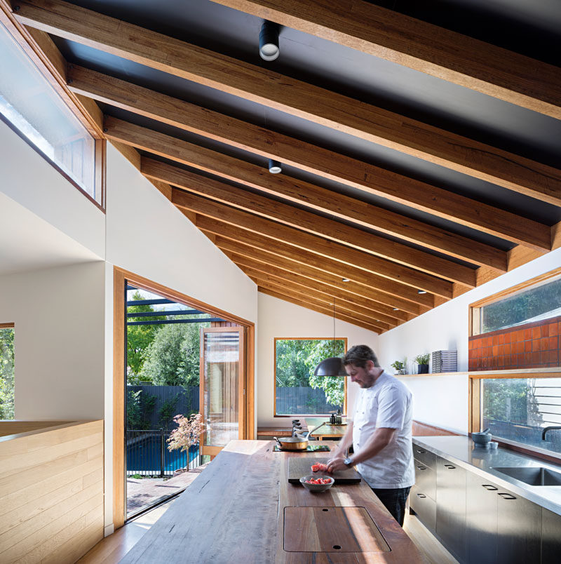 This contemporary kitchen features a solid Spotted Gum countertop of the kitchen island. Click through to see more photos. #SpottedGum #Kitchen #WoodCountertop #KitchenDesign