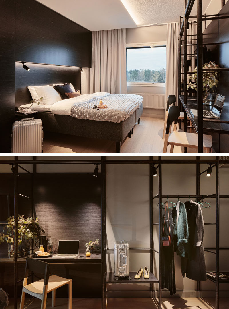 This modern hotel room has a dramatic look that's achieved with the use of dark wood. The built-in furniture is balanced by a open shelving unit with a desk and places to hang clothes. #HotelRoom #OpenShelving