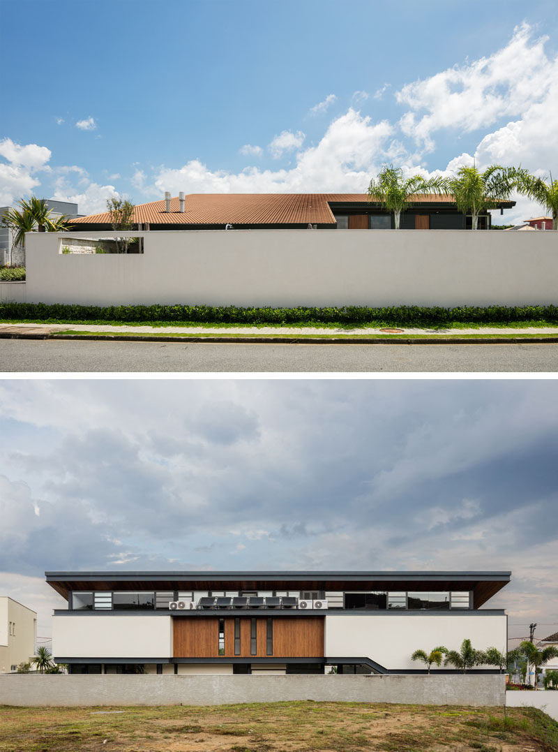 Obra Arquitetos have designed a new modern house in Sao Paulo, Brazil, that has a large sloping roof that integrates the interior living spaces with the outdoor spaces. #ModernHouse #SlopedRoof