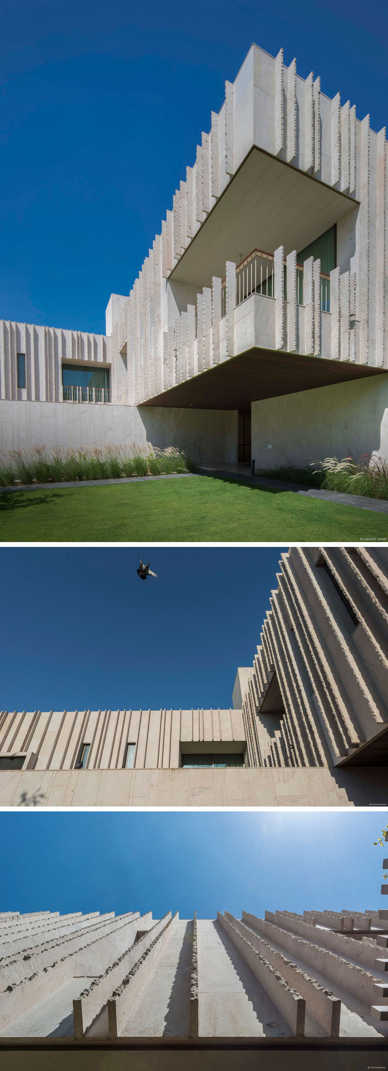 This modern house is covered in stone has a mottled texture and bone coloration. #Architecture #ModernHouse #Stone