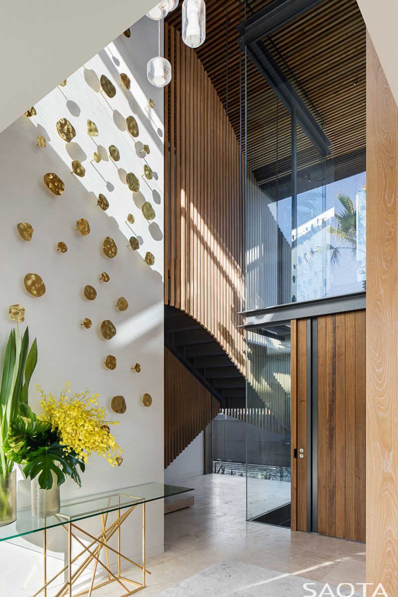 The gentle curve of the stairs contrasts with the surrounding crystalline box and mediates between the formal entrance and bedrooms above. #Stairs #Foyer