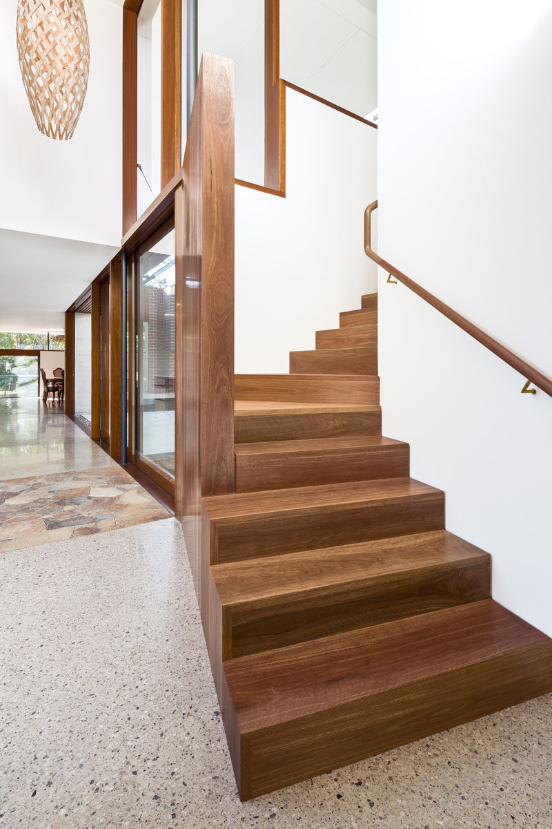 This modern house has wood stairs that lead to the master suite upstairs. Click through to see more photos of this Australian house. #ModernStairs #WoodStairs #Interiors