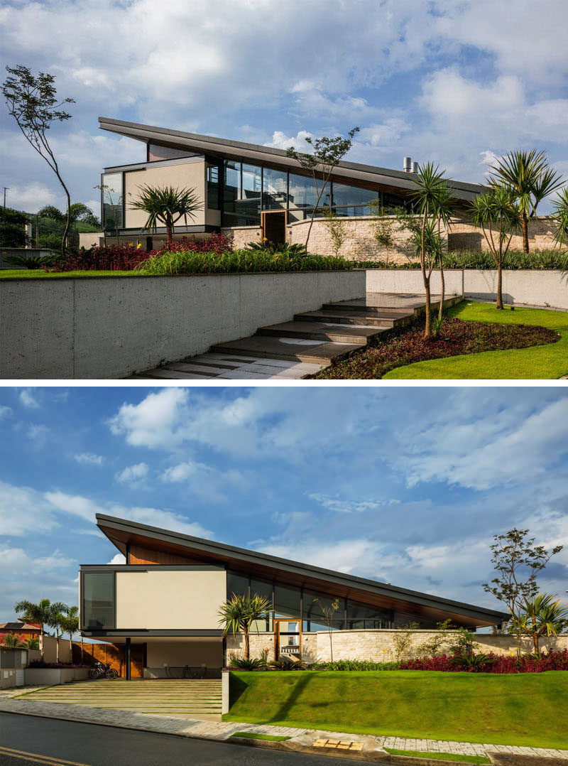 At the front of this modern house, a path leads from the street up to the front door, passing between the plants. #Landscaping #ModernHouse