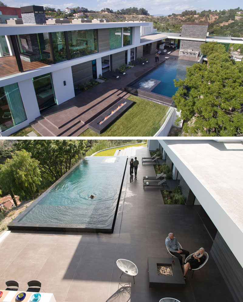The living areas of this modern house, as well as a few bedrooms, all open up to the deck, the backyard with a fireplace, and a swimming pool. #SwimmingPool #ModernHouse