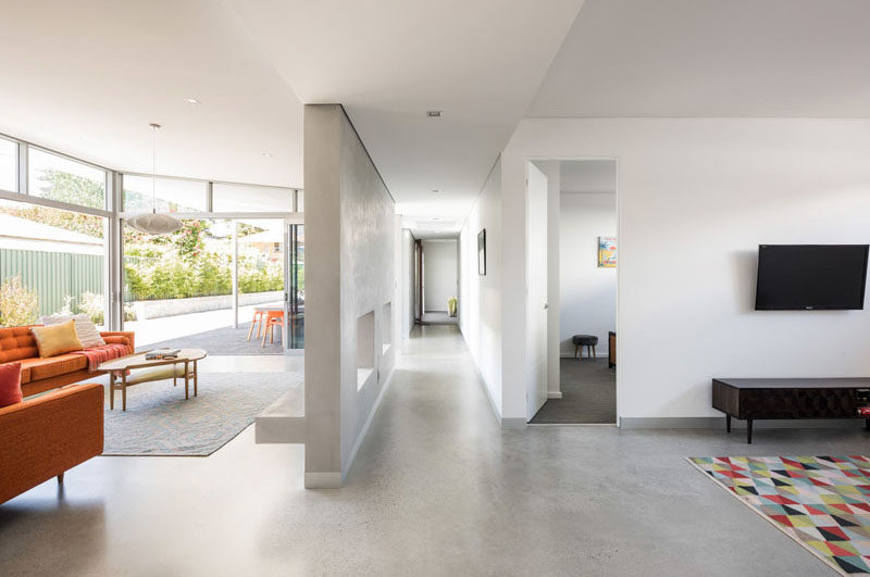 A central passage in this modern house acts as a simple access spine delineating and connecting the private and communal spaces. #Hallway #InteriorDesign