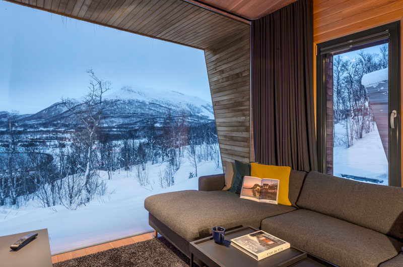 This modern living room has a large picture window that perfectly frames the view. #PictureWindow #LivingRoom