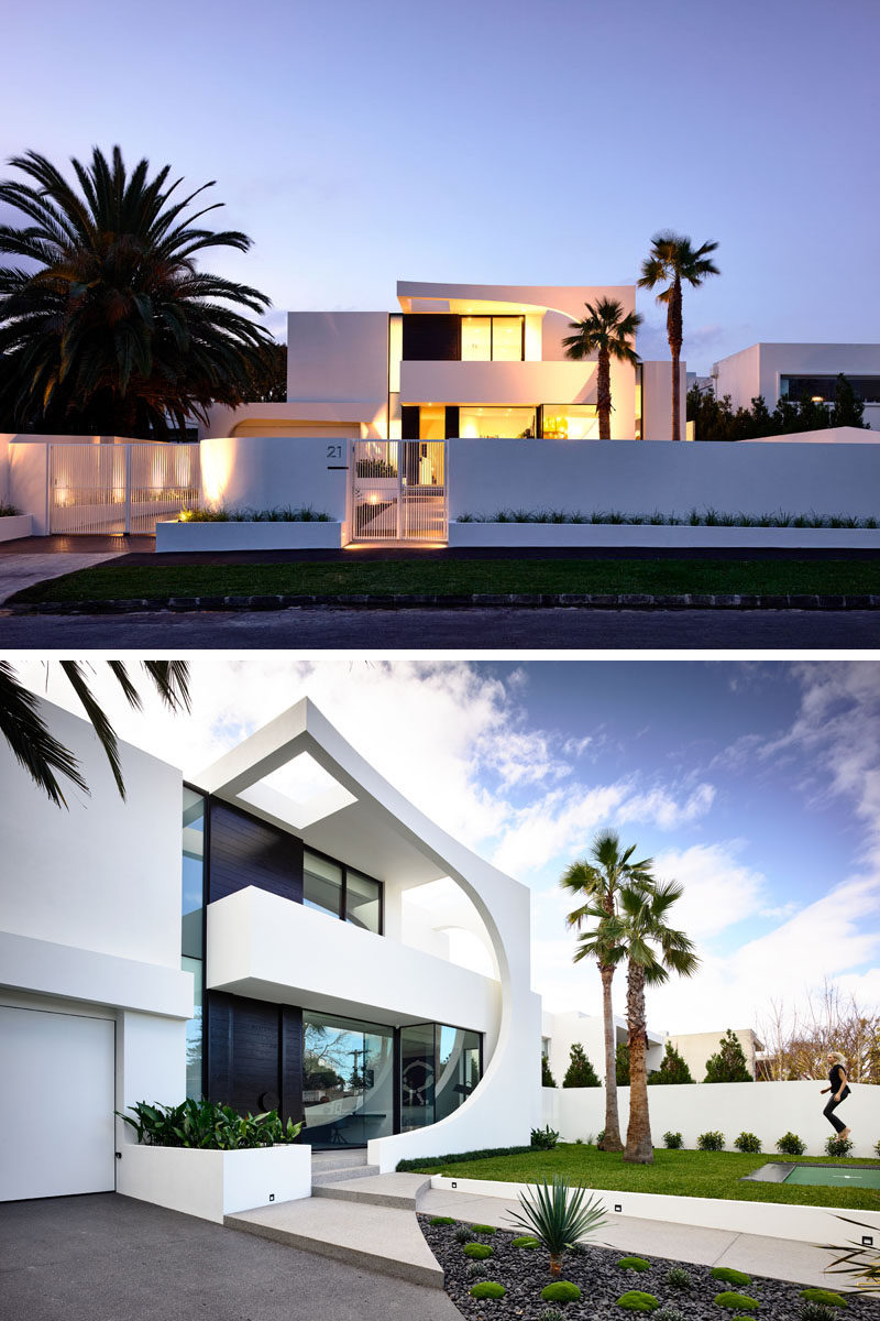 This modern house features a striking facade with a 2 storey curved section made from concrete that was cast in place. Click through to see more photos of this house. #ModernHouse #ModernArchitecture #HouseDesign #Facade #AustralianArchitecture #Landscaping