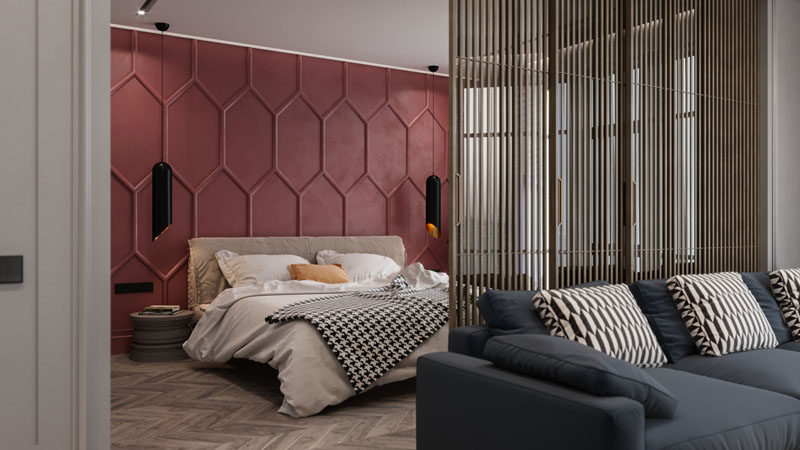 OM Architecture have designed an apartment in Kiev, Ukraine, that features a bold deep red accent wall in the bedroom. Moldings were used to create the pattern, while a single color helps to create a dramatic feature wall. #AccentWall #FeatureWall #Pattern #Bedroom #ModernBedroom #DeepRed