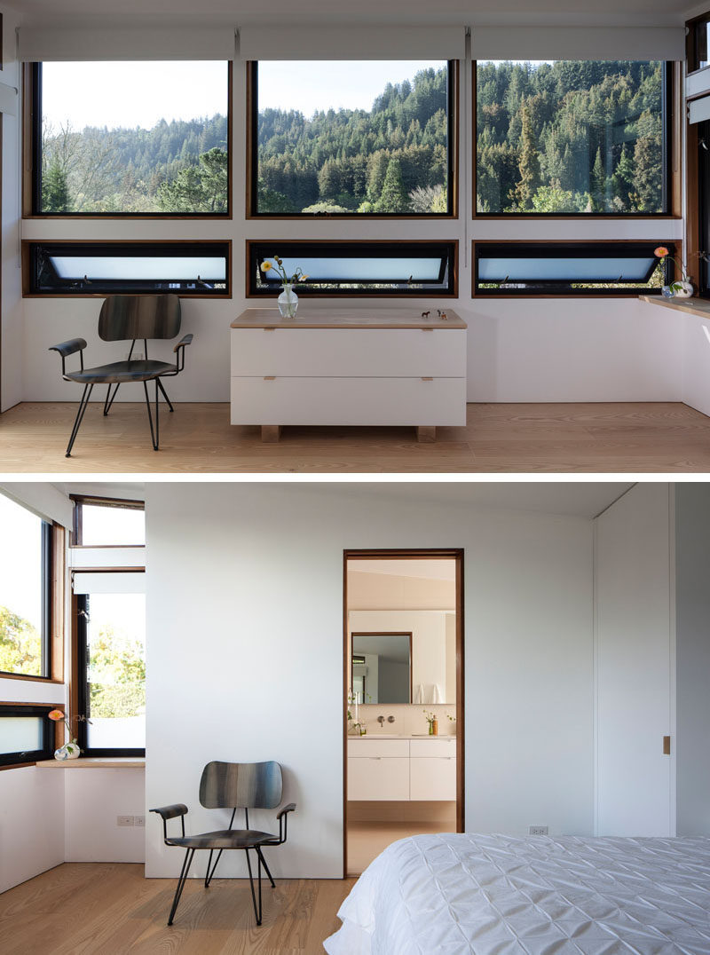 A wall of windows in this bedroom provide sweeping views of the trees. #windows #bedroom