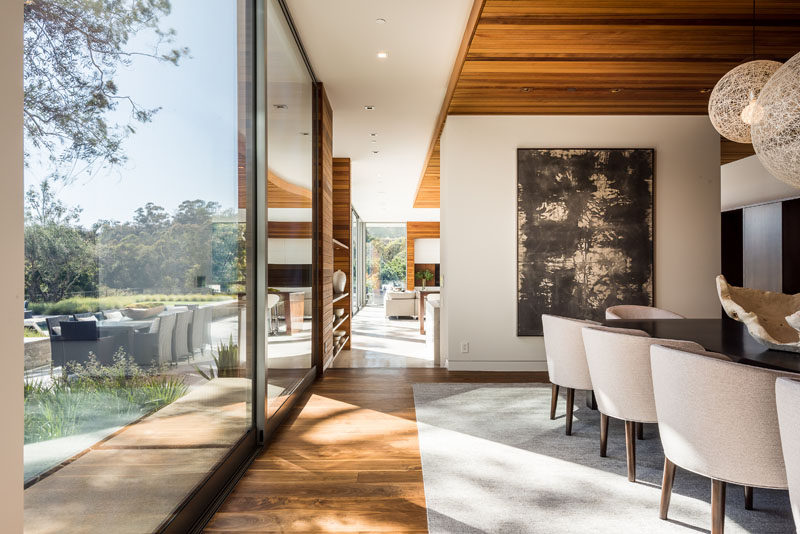 This contemporary dining room features Walnut flooring. #Flooring #WoodFlooring #DiningRoom