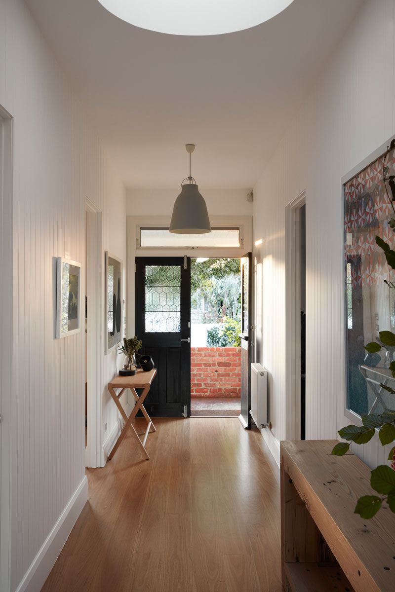 To retain the original characteristics of this old Australian house, rotting floorboards were replaced with new boards, giving the home a fresh update. #WoodFlooring #Skylight #Hallway #InteriorDesign