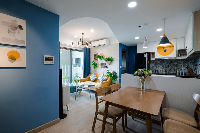 Design studio TOKI HOME  have completed a cozy apartment in Vietnam for a mother and her 5-year-old son, who wanted a cheerful space that would be welcoming. Click through to see more photos of this contemporary apartment. #InteriorDesign #BlueAndYellow