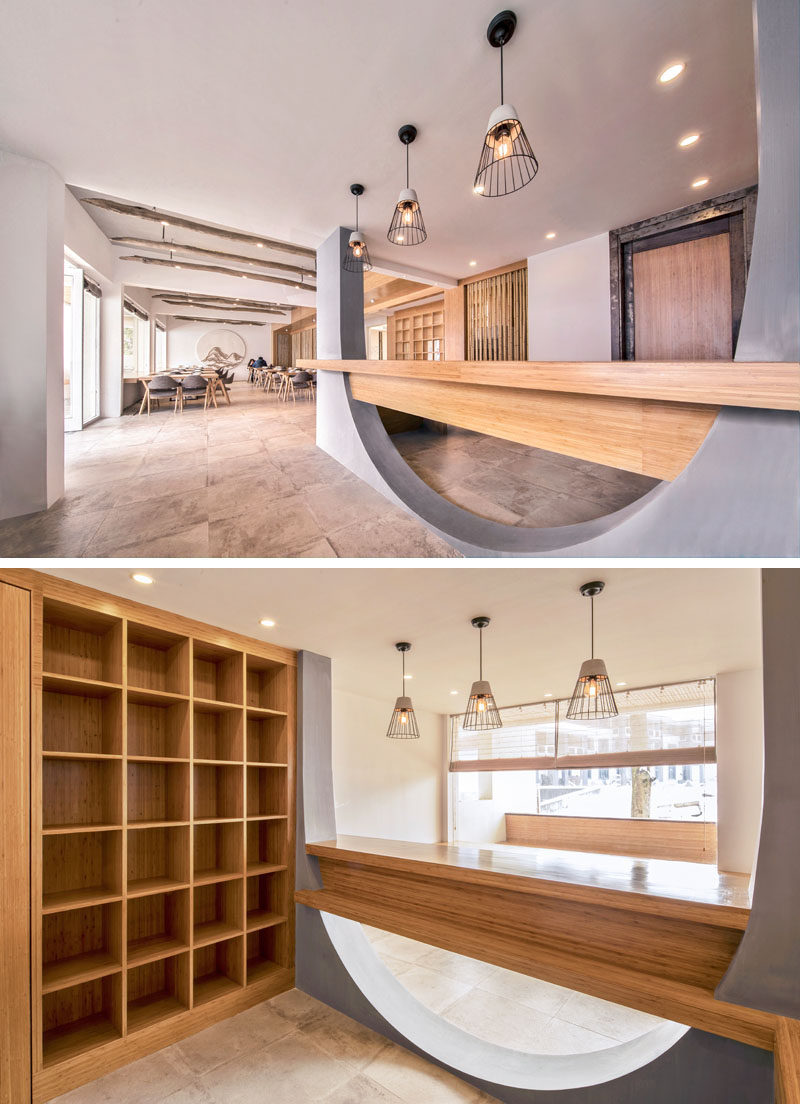 Inside this hotel, wood elements are abundant, and they have been paired with concrete and white walls for a modern and updated interior. #ModernHotel #HotelDesign #Wood #CurvedConcrete