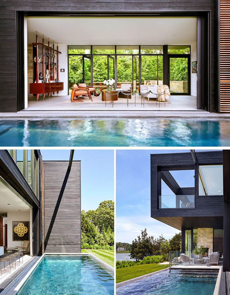 Floor to ceiling, wall to wall glass panels open the center of this modern house to the outdoors, creating a true indoor/outdoor living environment. On one side of the living room is the front patio, and on the other is the swimming pool. #ModernHouse #SwimmingPool #LivingRoom #GlassWalls