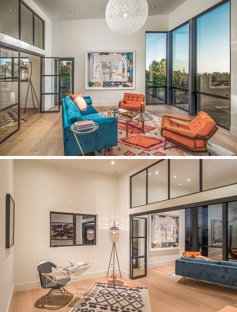 This modern home office has a glass wall separating the work area from a more relaxed living room. #HomeOffice #InteriorDesign #LivingRoom