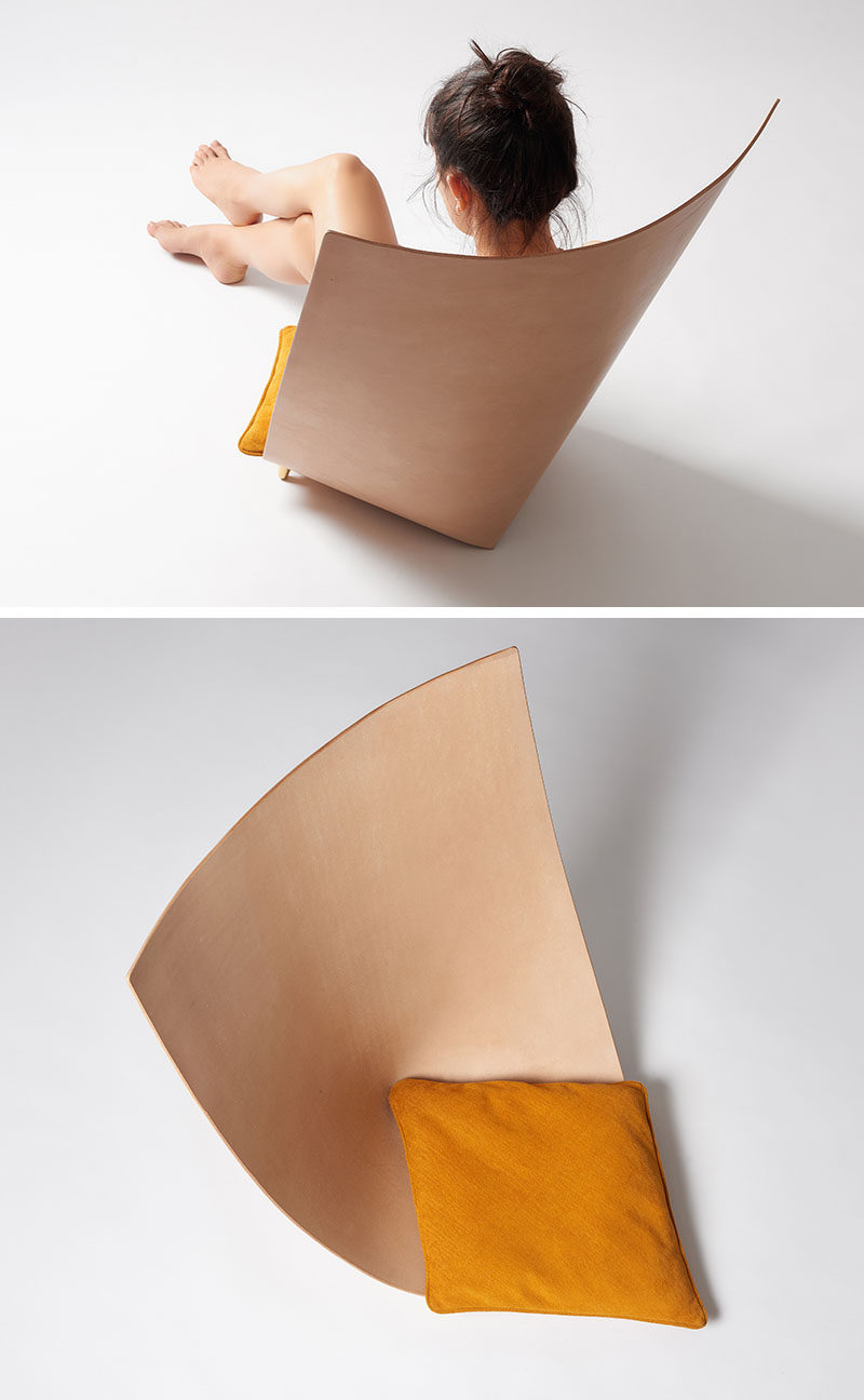 Jordi Ribaudí has designed a modern and sculptural chair, that's made from a single leather piece that backs back on itself to create the backrest, while small brass feet keep the structure together. #Design #Furniture #Chair #Seat #Leather