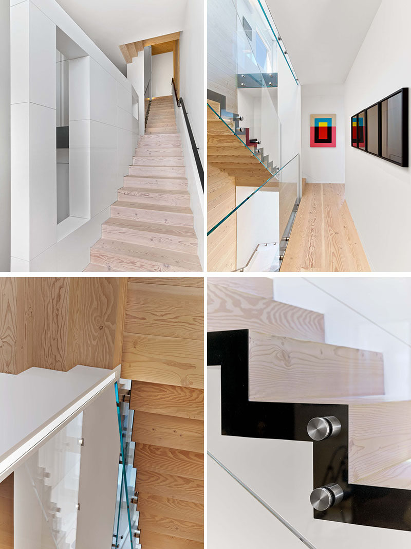 Wide-plank reclaimed Douglas Fir floors are featured throughout this modern house, including on the stairs, which combine steel, glass and wood, and connect the multiple levels of the home. #ModernStairs #StairDesign #WoodFlooring