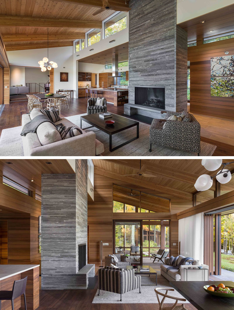 This modern house has an open plan living, dining and kitchen area, with a stacked stone fireplace. #OpenPlanLiving #InteriorDesign #LivingRoom #StackedStone #StoneFireplace