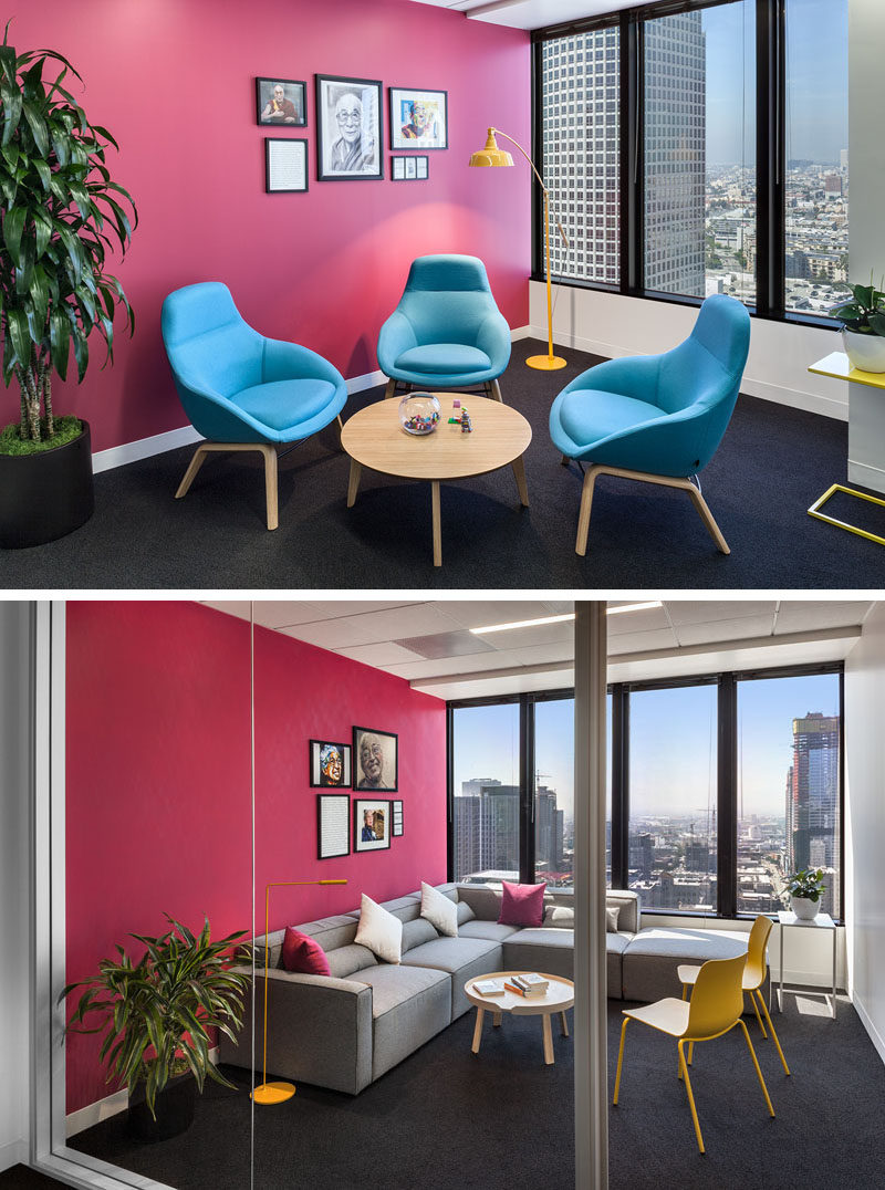 These modern offices have bright pink walls to add a pop of color. #PinkWall #OfficeDesign #MeetingRoom