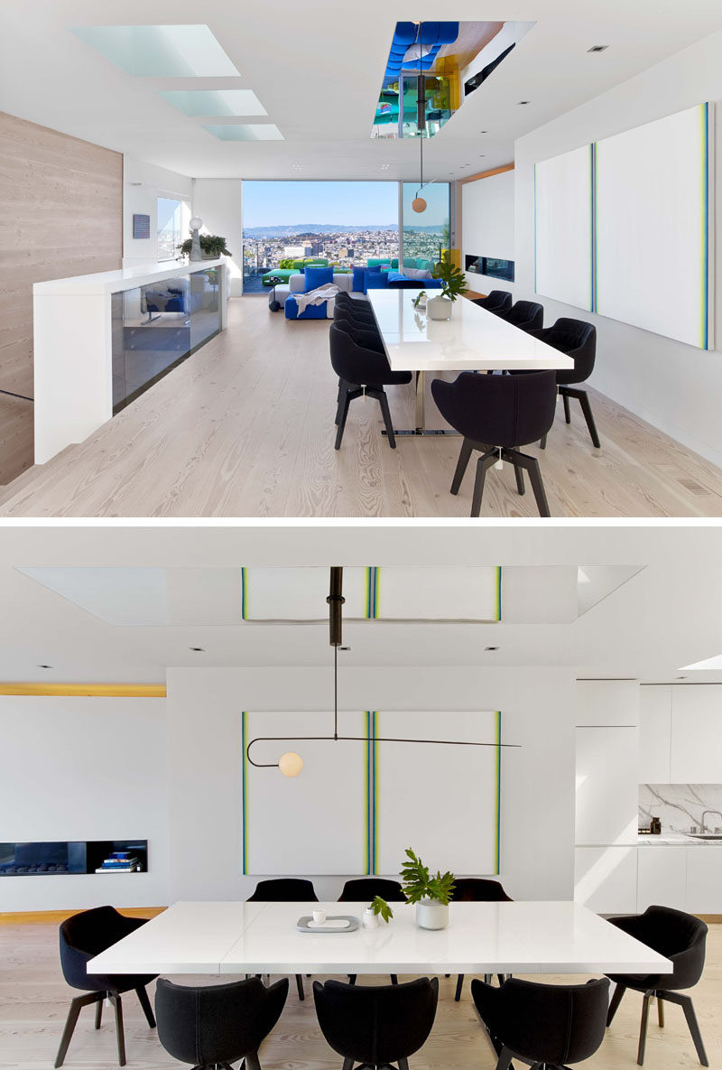 This modern dining area has a polished stainless steel ceiling over the dining table. #DiningRoom #WhiteDiningTable #ModernDiningArea 