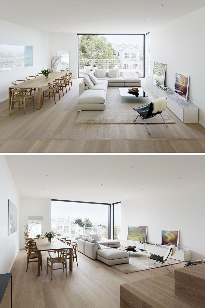 This modern house has an open dining room and living room, and it opens up to a balcony at the rear of the house. #ModernInterior #DiningRoom #InteriorDesign #LivingRoom