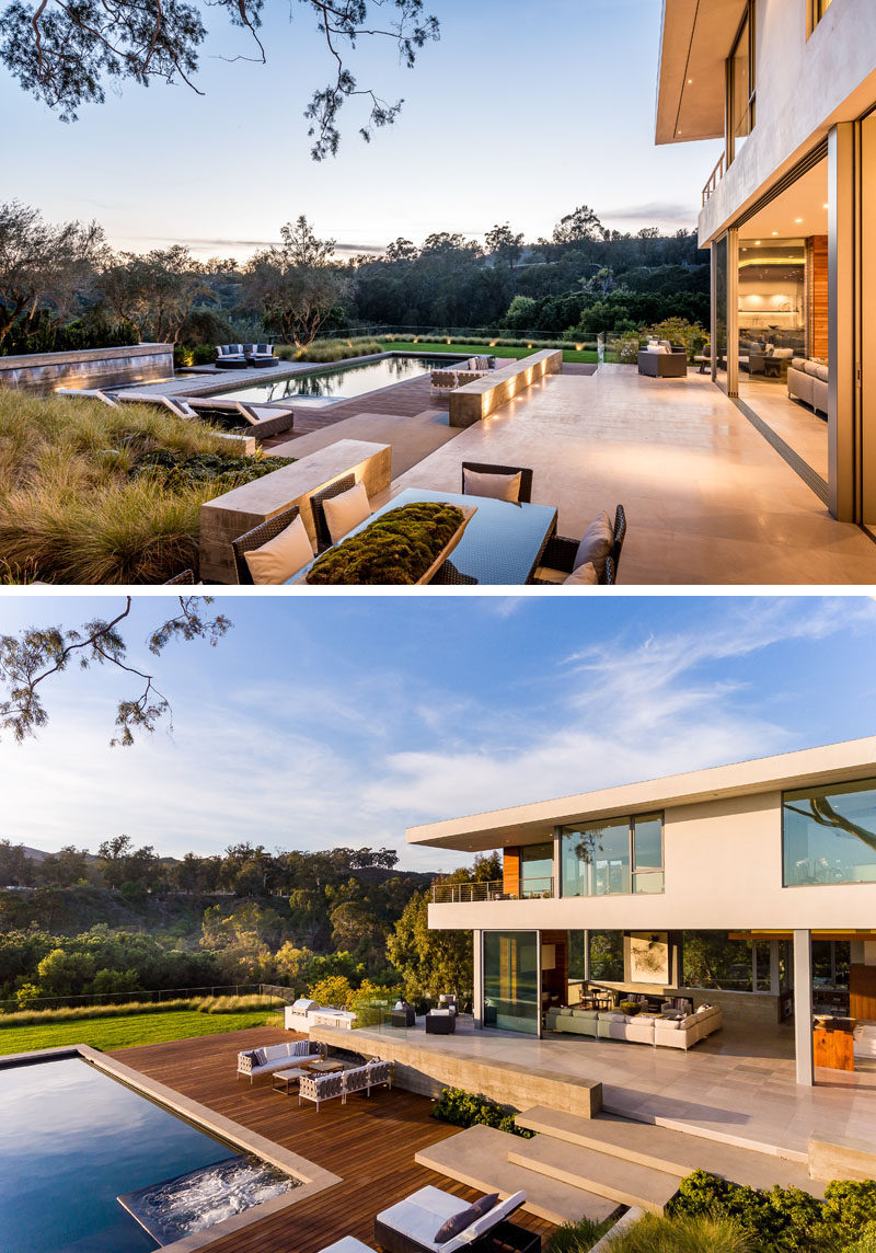 This modern house has a terrace that provides expansive views of the backyard and canyon beyond. The backyard is home to 4 outdoor fireplaces and a fire pit, a level grassy lawn, a regulation Bocce court and array of dining and entertaining terraces. #Backyard #Terrace #SwimmingPool #Landscaping