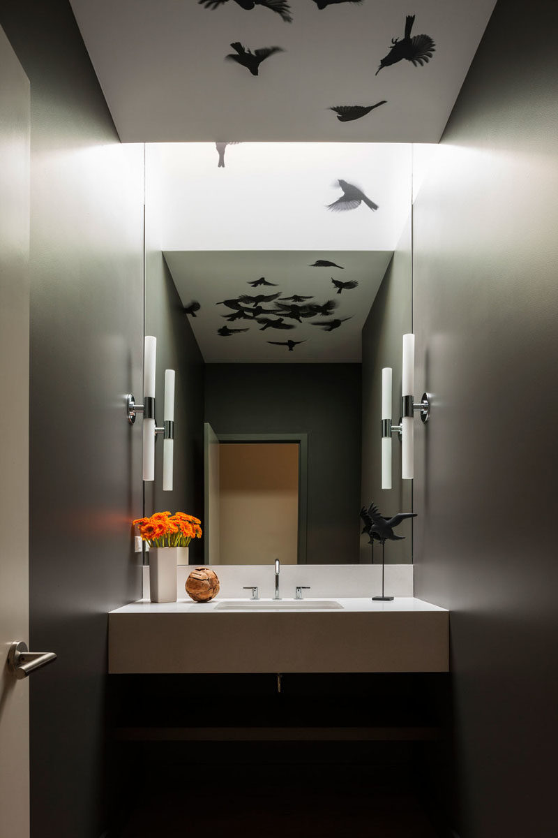 In this modern powder room, a graphic bird wall covering from Trove has been used to create a unique appearance. #Wallpaper #Birds #PowderRoom #Bathroom