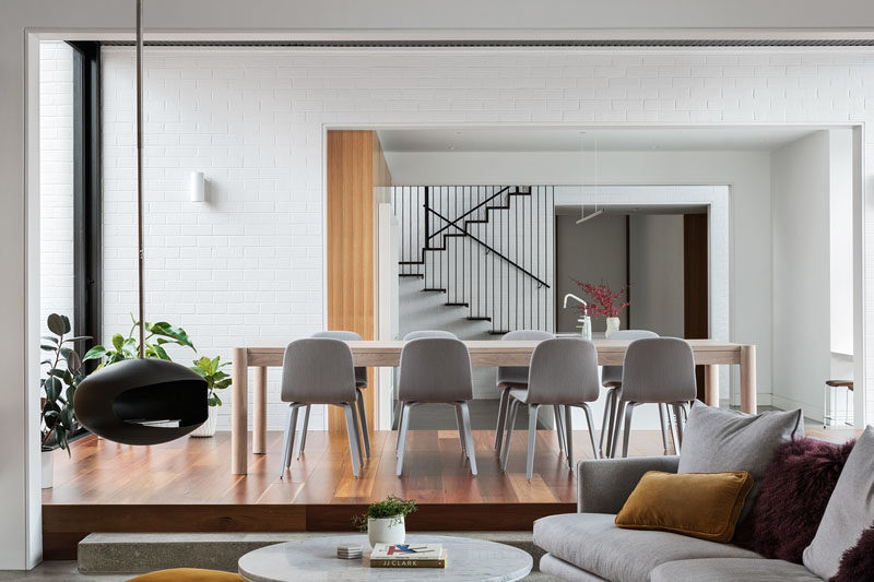 This modern dining room is slightly raised up from the kitchen and living room. #DiningRoom #RaisedDiningArea #ModernDiningRoom