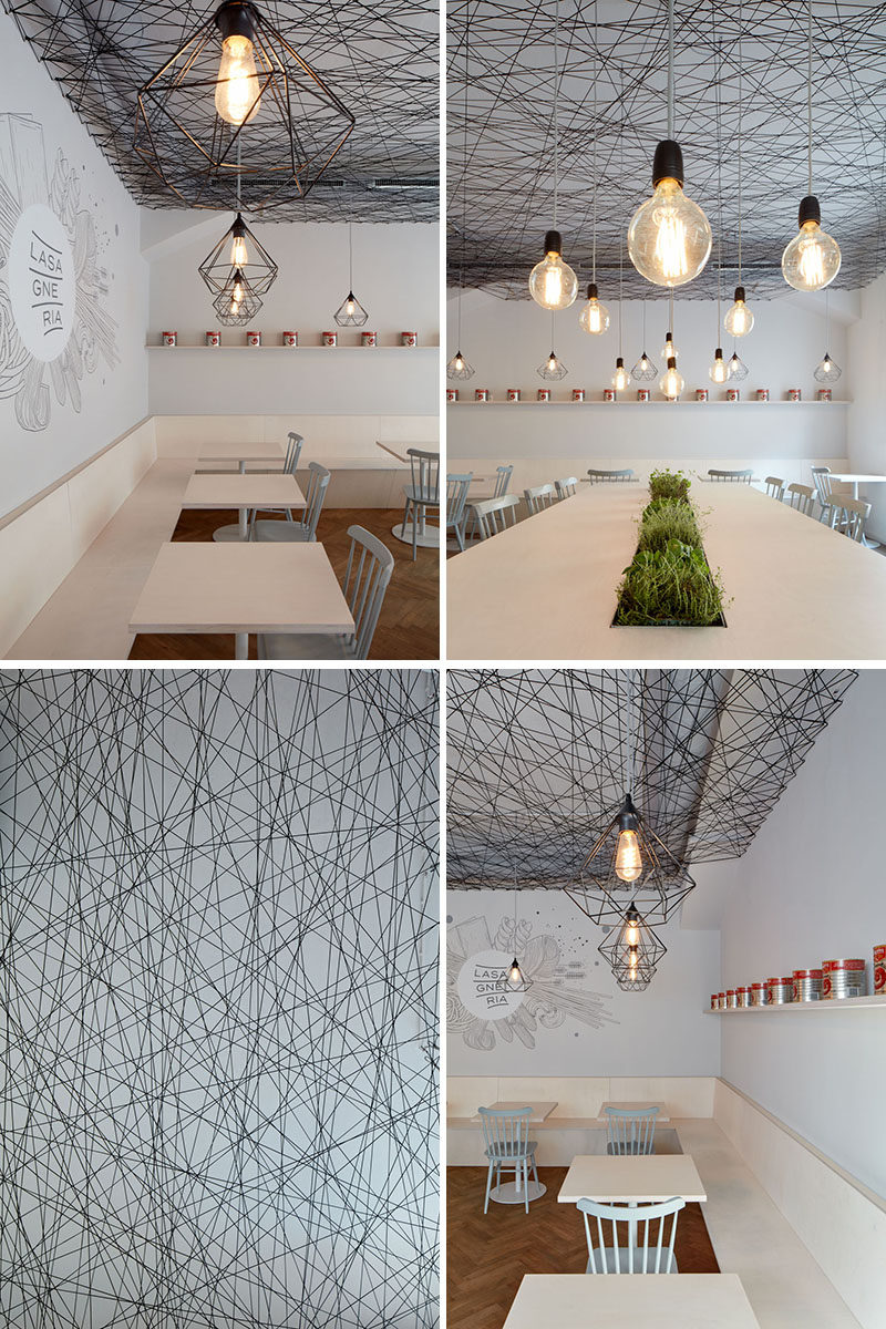 mars.s architects have designed a modern bistro with an irregular web semi-transparent suspended ceiling made from black string. #ModernBistro #ModernInterior #ModernRestaurant #InteriorDesign #Ceiling